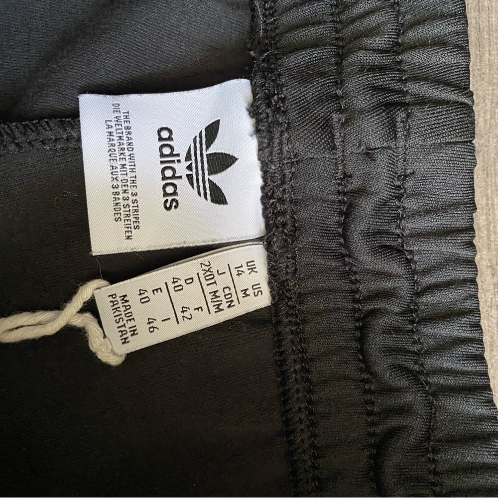 Adidas Track pants in black . Size M